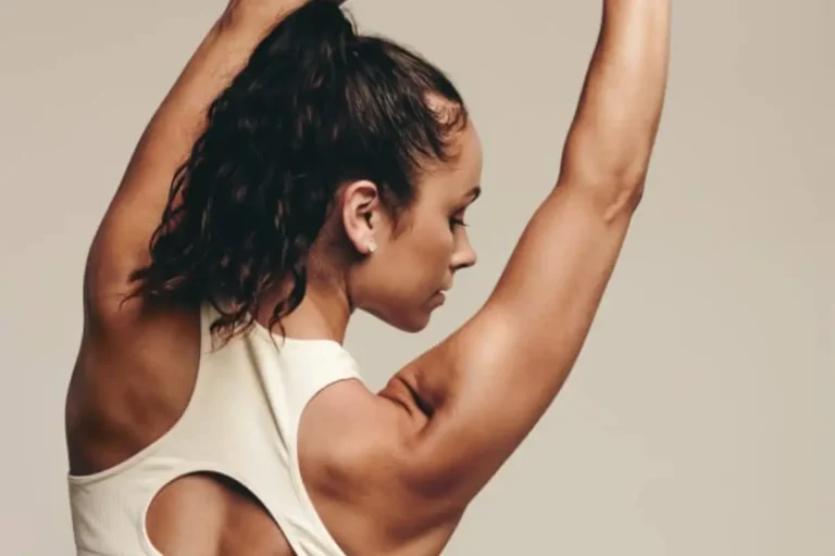 Lady Stretching with perfect figure after body contouring treatment in Bismarck, ND | Embrace Wellness
