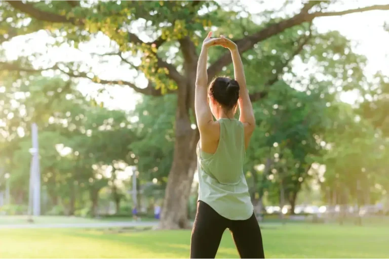 Lady Doing Exercise in a park after Ozone Therapy at Embrace Wellness in Bismarck, ND