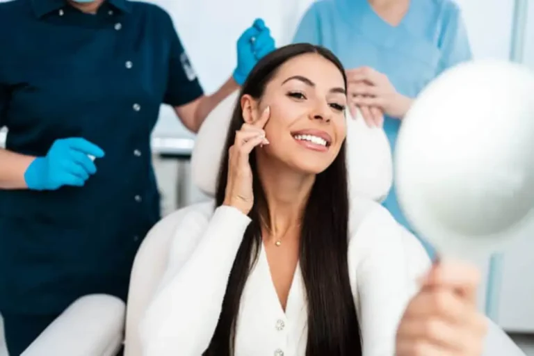 Woman seeing her face in mirror | Pre and Post OP Care in Bismarck, ND