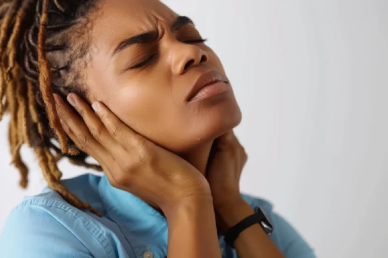 Girl holding neck seeking for fibromyalgia treatment in bismarck, nd | Embrace Wellness