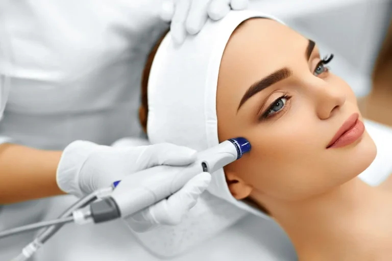 Beautiful woman getting hydrafacial treatment at Embrace Wellness in Bismarck, ND