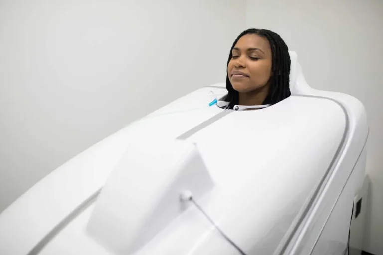 Woman Receiving HOCatt Infrared LIght Therapy in Bismarck, ND