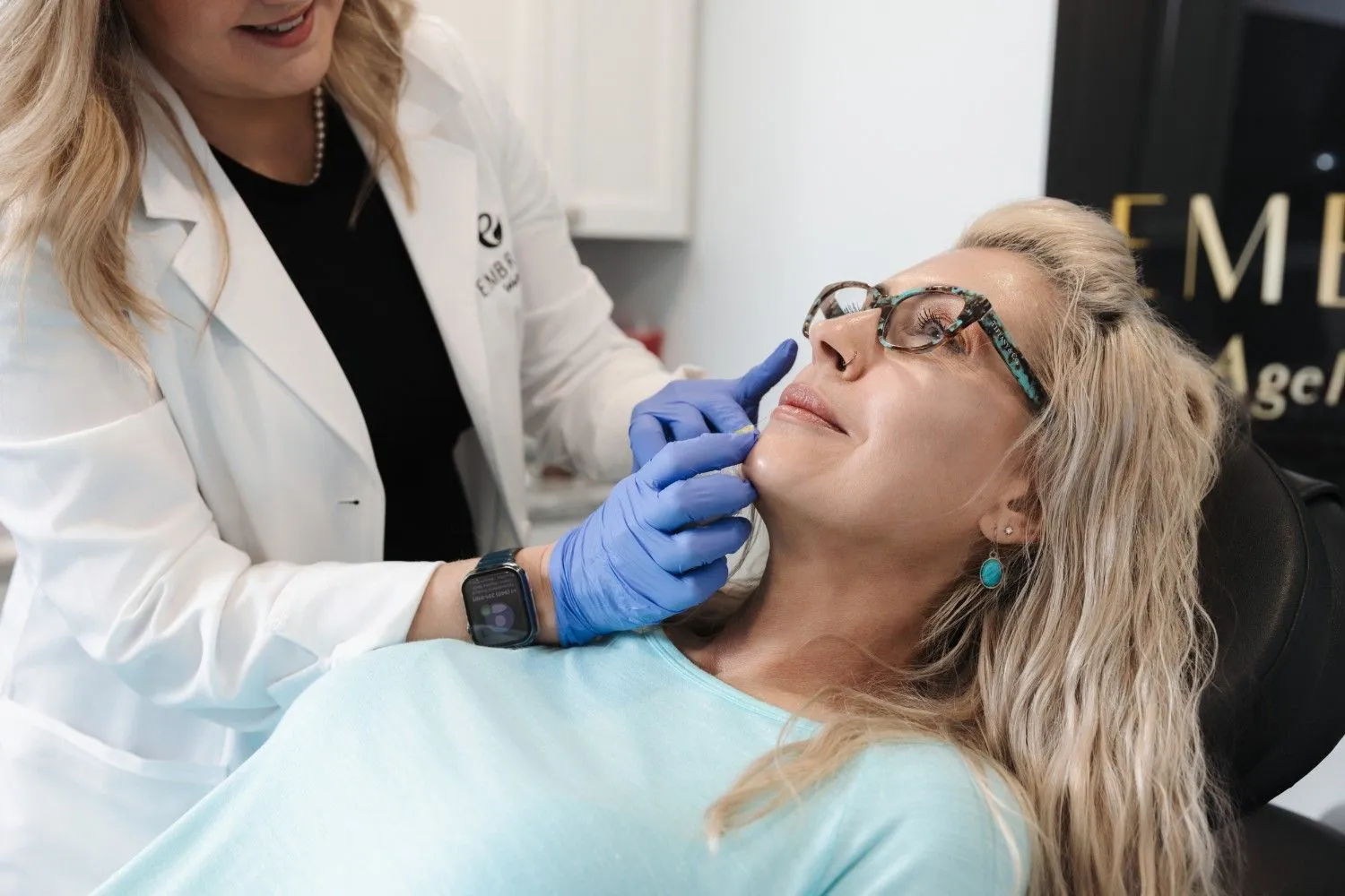 Woman with glowing skin during facial treatment at medical spa in Bismarck, ND