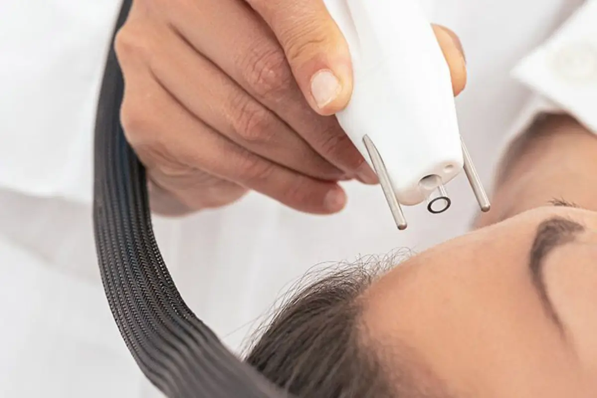 Woman getting Agejet plasma rejuvenation treatment in Bismarck, ND | Embrace Wellness